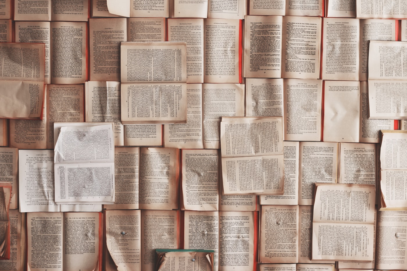 Open books on a desk — English tuition